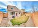 Backyard with patio, grassy area, and gravel at 5658 Adobe Jack St, North Las Vegas, NV 89031