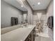 Bathroom with shower and tub, vanity with quartz countertop at 5658 Adobe Jack St, North Las Vegas, NV 89031