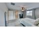 Bright bedroom featuring a ceiling fan and large mirror at 5658 Adobe Jack St, North Las Vegas, NV 89031