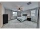 Spacious bedroom with ceiling fan and carpeted floor at 5658 Adobe Jack St, North Las Vegas, NV 89031