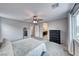 Bedroom with ceiling fan, dresser and en-suite bathroom at 5658 Adobe Jack St, North Las Vegas, NV 89031