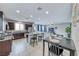 Modern kitchen with island and stainless steel appliances at 5658 Adobe Jack St, North Las Vegas, NV 89031