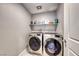 Laundry room with washer and dryer and shelving at 5658 Adobe Jack St, North Las Vegas, NV 89031