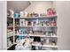 Well-stocked pantry with ample shelving for storage at 5658 Adobe Jack St, North Las Vegas, NV 89031