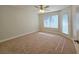 Spacious bedroom with ceiling fan and large windows at 5710 Tropicana Ave # 1063, Las Vegas, NV 89122