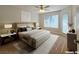 Virtually staged main bedroom with a king-size bed and private access at 5710 Tropicana Ave # 1063, Las Vegas, NV 89122