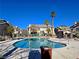 Inviting kidney-shaped community pool with surrounding lounge chairs at 5710 Tropicana Ave # 1063, Las Vegas, NV 89122