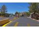 Gated entrance to community with landscaping and parking at 5710 Tropicana Ave # 1063, Las Vegas, NV 89122