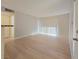 Bright living room with wood-look floors and sliding glass door at 5710 Tropicana Ave # 1063, Las Vegas, NV 89122