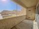 Screened patio with exterior door and view of parking lot at 5710 Tropicana Ave # 1063, Las Vegas, NV 89122