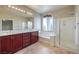 Elegant bathroom with double sinks, soaking tub, and shower at 5744 Serenity Haven St, North Las Vegas, NV 89081