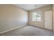 Spacious bedroom with large window and carpet at 5744 Serenity Haven St, North Las Vegas, NV 89081