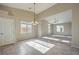 Bright dining room with tile floors and view into the living room at 5744 Serenity Haven St, North Las Vegas, NV 89081