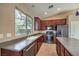 Kitchen with stainless steel appliances and dark wood cabinets at 5744 Serenity Haven St, North Las Vegas, NV 89081