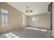 Living room featuring large windows and carpet flooring at 5744 Serenity Haven St, North Las Vegas, NV 89081