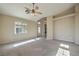 Spacious living room with vaulted ceilings and ceiling fan at 5744 Serenity Haven St, North Las Vegas, NV 89081