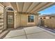 Patio area with a door and partial view of the yard at 5744 Serenity Haven St, North Las Vegas, NV 89081