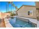 Inviting pool with a large patio and surrounding landscaping at 5744 Serenity Haven St, North Las Vegas, NV 89081