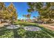 Community putting green with sand traps and surrounding trees at 5744 Serenity Haven St, North Las Vegas, NV 89081