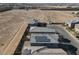 Aerial view of houses with solar panels and surrounding desert landscape at 5921 Roaring Canyon Ct, Las Vegas, NV 89139