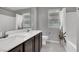 Bathroom with double sinks, bathtub, and patterned shower curtain at 5921 Roaring Canyon Ct, Las Vegas, NV 89139