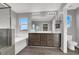 Double vanity bathroom with large mirror and walk-in shower at 5921 Roaring Canyon Ct, Las Vegas, NV 89139