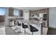 Kitchen with granite countertops, stainless steel appliances, and island at 5921 Roaring Canyon Ct, Las Vegas, NV 89139