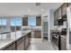 Kitchen with granite countertops, stainless steel appliances, and pantry at 5921 Roaring Canyon Ct, Las Vegas, NV 89139