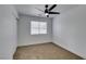 Spacious bedroom featuring a ceiling fan and window at 5934 Clear Valley Ave, Las Vegas, NV 89142