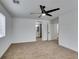 Spacious bedroom with ceiling fan and carpeting at 5934 Clear Valley Ave, Las Vegas, NV 89142