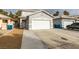 Two-story house with attached garage and driveway at 5934 Clear Valley Ave, Las Vegas, NV 89142