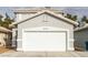 Two-story house with attached garage and neutral exterior at 5934 Clear Valley Ave, Las Vegas, NV 89142