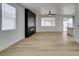 Spacious living room featuring a modern fireplace and light hardwood floors at 5934 Clear Valley Ave, Las Vegas, NV 89142