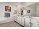 Modern bathroom with double vanity, soaking tub, and glass shower at 5969 Viscaya Grove St, Las Vegas, NV 89118