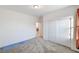 Well-lit bedroom with double sliding doors at 5969 Viscaya Grove St, Las Vegas, NV 89118