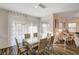 Bright dining area with a glass-top table and six chairs at 5969 Viscaya Grove St, Las Vegas, NV 89118