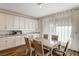 Well-equipped kitchen with white cabinets and ample counter space at 5969 Viscaya Grove St, Las Vegas, NV 89118