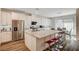 Modern kitchen with white cabinets, granite counters, and stainless steel appliances at 5969 Viscaya Grove St, Las Vegas, NV 89118