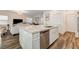 Modern kitchen island with granite countertop and stainless steel dishwasher at 5969 Viscaya Grove St, Las Vegas, NV 89118