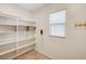 Well-organized pantry with ample shelving and tile flooring at 5969 Viscaya Grove St, Las Vegas, NV 89118