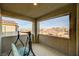 Relaxing balcony with city views and a porch swing at 5969 Viscaya Grove St, Las Vegas, NV 89118