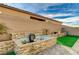 Relaxing water feature with stonework and landscaping at 5969 Viscaya Grove St, Las Vegas, NV 89118