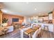 Open concept living and dining area with terracotta walls and wood floors at 6188 Lily Garden St # 110, North Las Vegas, NV 89081