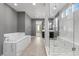 Modern bathroom with soaking tub and glass shower at 6332 Ava Ridge Ave, Las Vegas, NV 89141