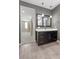 Modern bathroom with dark vanity and gray walls at 6332 Ava Ridge Ave, Las Vegas, NV 89141