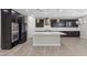 Modern kitchen with island and dark cabinetry at 6332 Ava Ridge Ave, Las Vegas, NV 89141