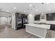 Modern kitchen with island, dark cabinetry, and stainless steel appliances at 6332 Ava Ridge Ave, Las Vegas, NV 89141