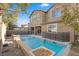 Stunning pool with waterfall feature in the backyard at 6332 Ava Ridge Ave, Las Vegas, NV 89141