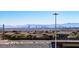 Neighborhood view with Las Vegas city skyline in the distance at 6434 Spring Jog St, Las Vegas, NV 89166