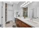 Elegant bathroom with double vanity and large walk-in shower at 6434 Spring Jog St, Las Vegas, NV 89166